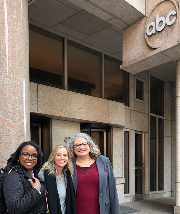 Group in front of building