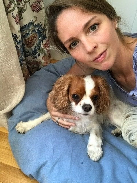 Robyn MacAlpine snuggling her dog