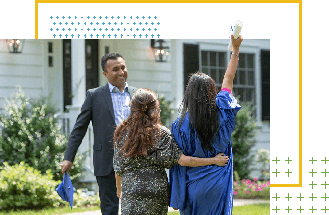 Graduate celebrating with father and siste
